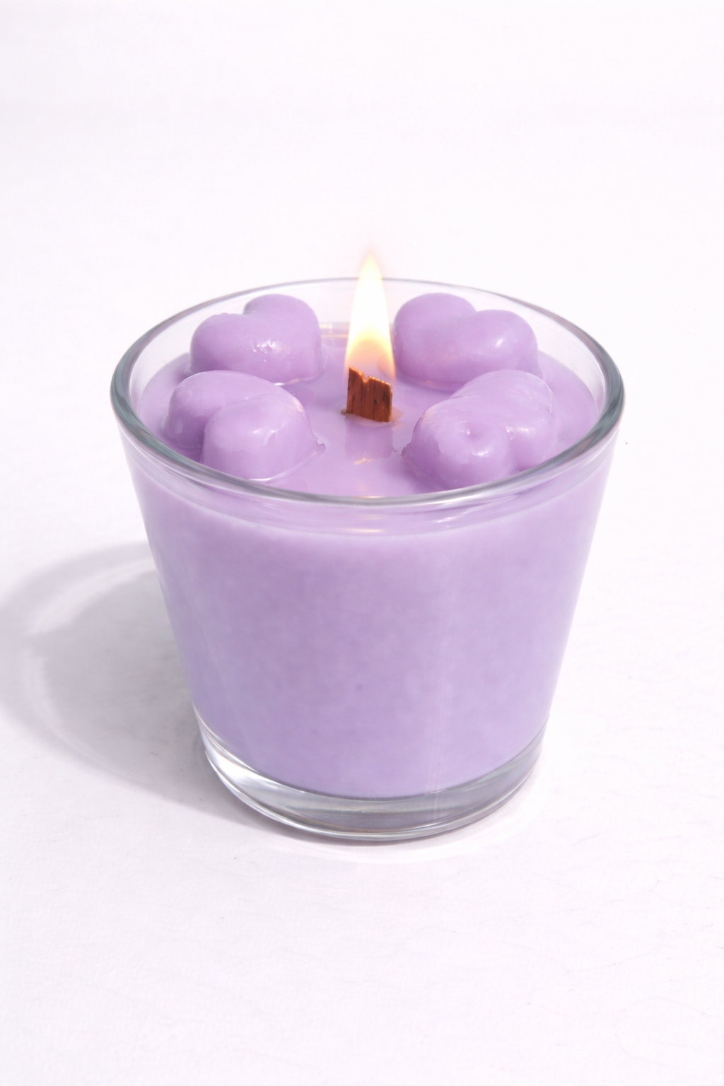 Vela aromática de frutas Vertical Essence’s en vaso de cristal, cera vegetal artesanal con colores frutales, aroma dulce y fresco, diseño elegante y natural para ambientación.