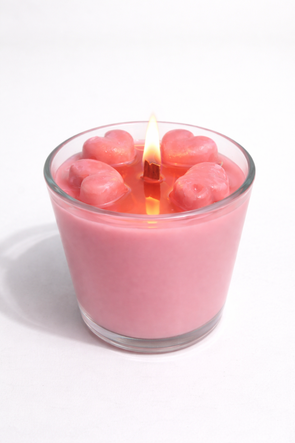 Vela aromática de frutas Vertical Essence’s en vaso de cristal, cera vegetal artesanal con colores frutales, aroma dulce y fresco, diseño elegante y natural para ambientación.