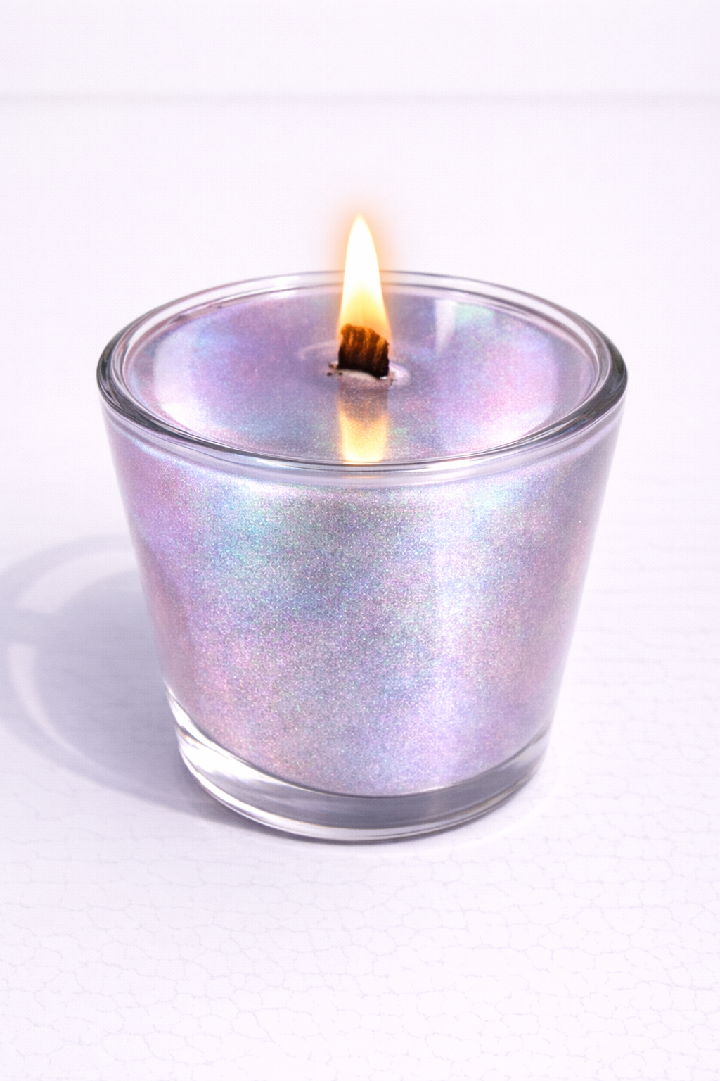 Vela espejo Vertical Essence’s en vaso de cristal, acabado reflectante efecto espejo, diseño minimalista de lujo, vela aromática artesanal con superficie brillante y elegante.