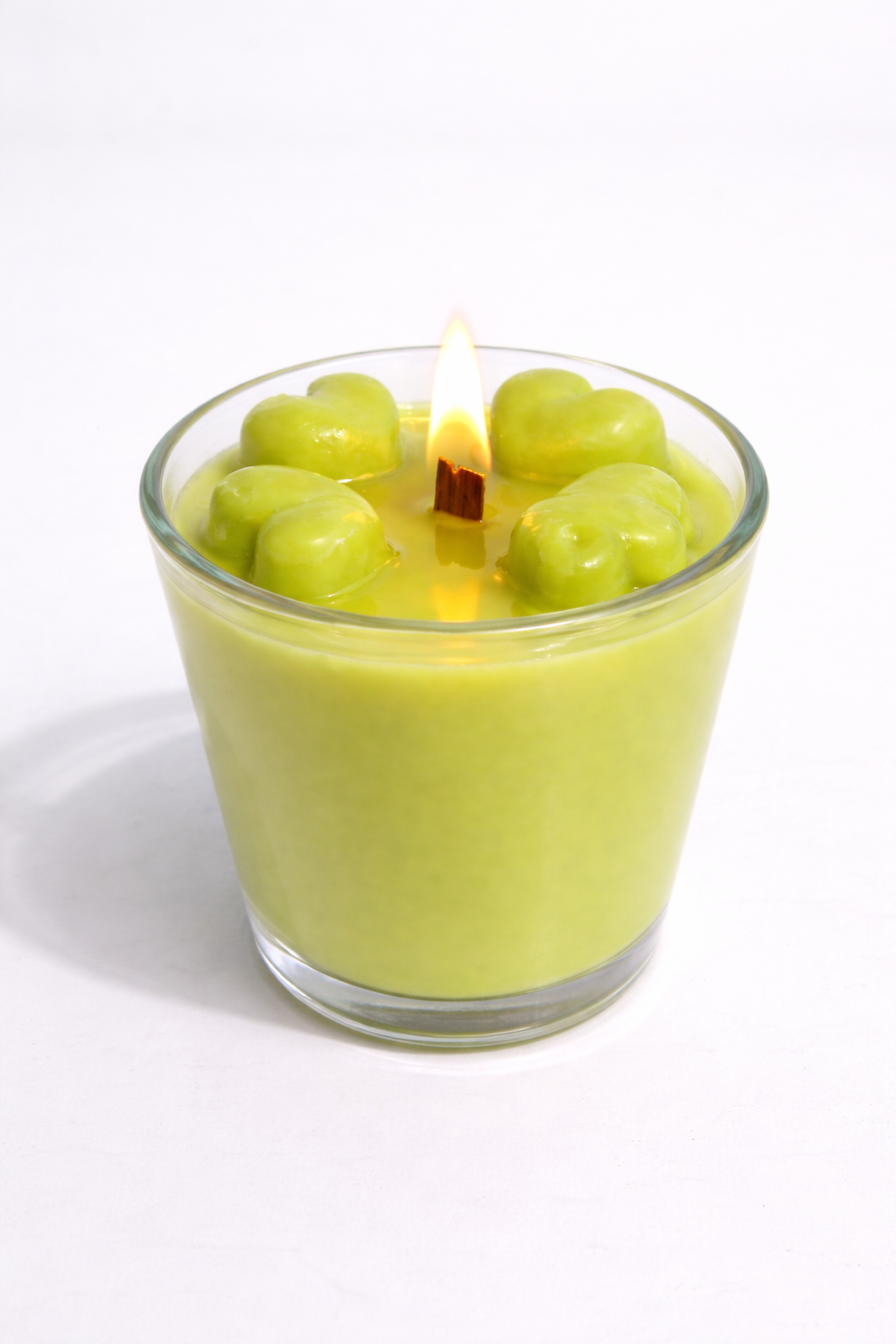 Vela aromática de frutas Vertical Essence’s en vaso de cristal, cera vegetal artesanal con colores frutales, aroma dulce y fresco, diseño elegante y natural para ambientación.