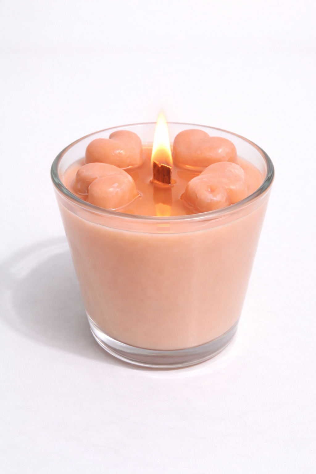 Vela aromática de frutas Vertical Essence’s en vaso de cristal, cera vegetal artesanal con colores frutales, aroma dulce y fresco, diseño elegante y natural para ambientación.